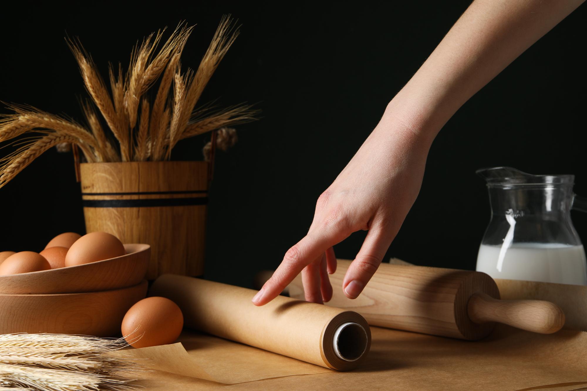 Hands preparing artisanal pastry with rolling pin
