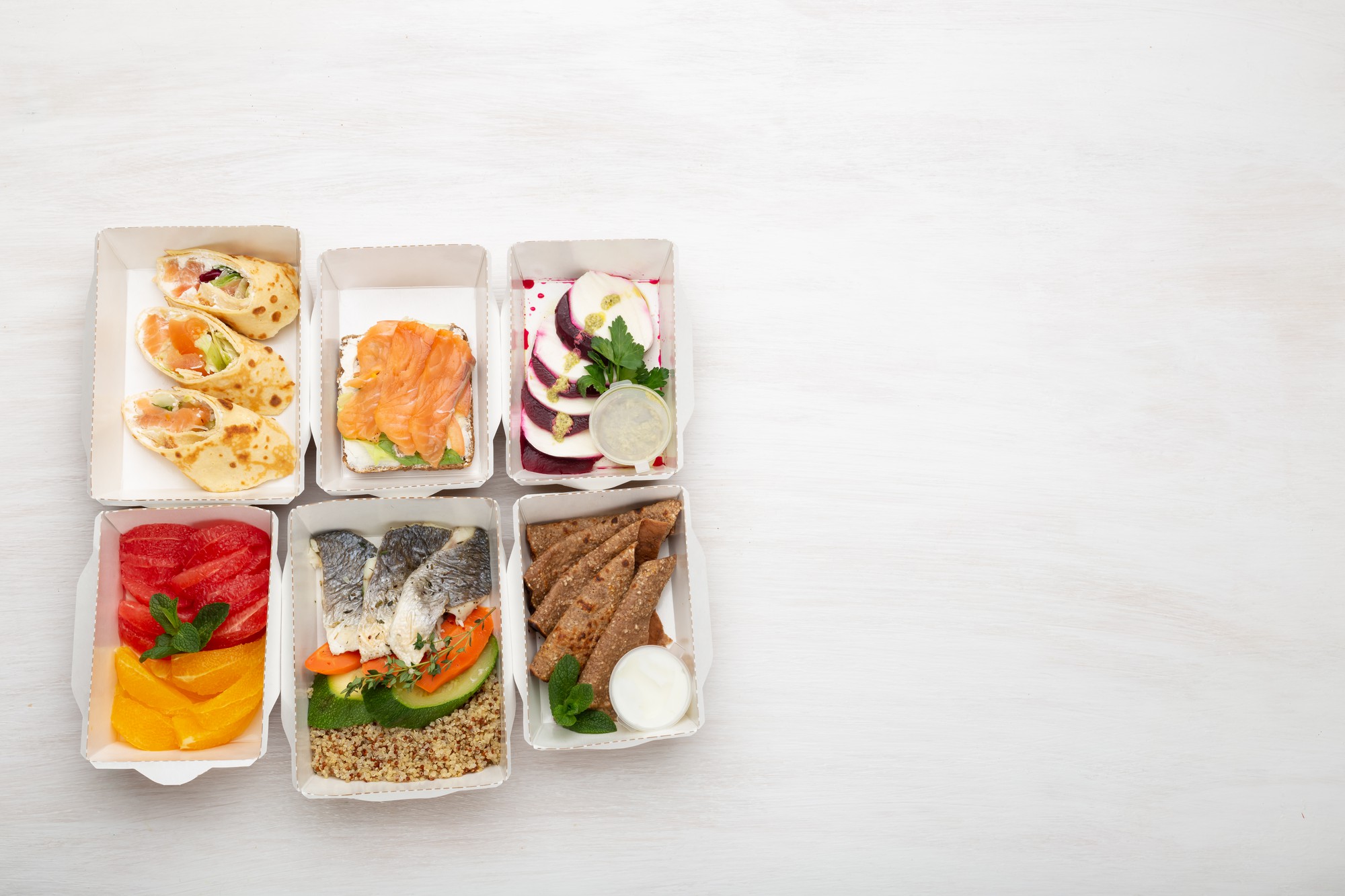 Assorted packaged meal kits on table
